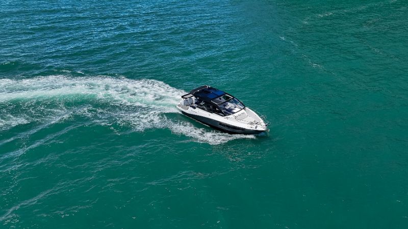 Luxury bow rider boat cruising on clear blue water near Melbourne Florida coast
